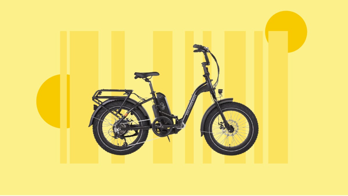 Black electronic bike side view against a yellow background