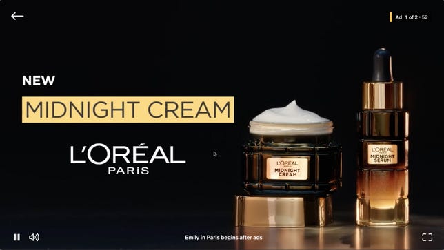 A L'Oreal Paris commercial for "New Midnight Cream" also shows the message "Emily in Paris begins after ad."