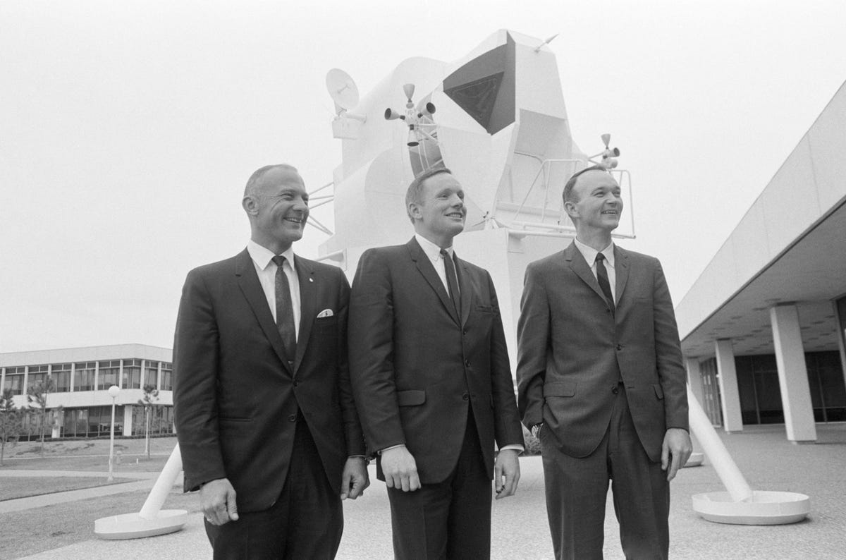 The Apollo 11 crew in business suits