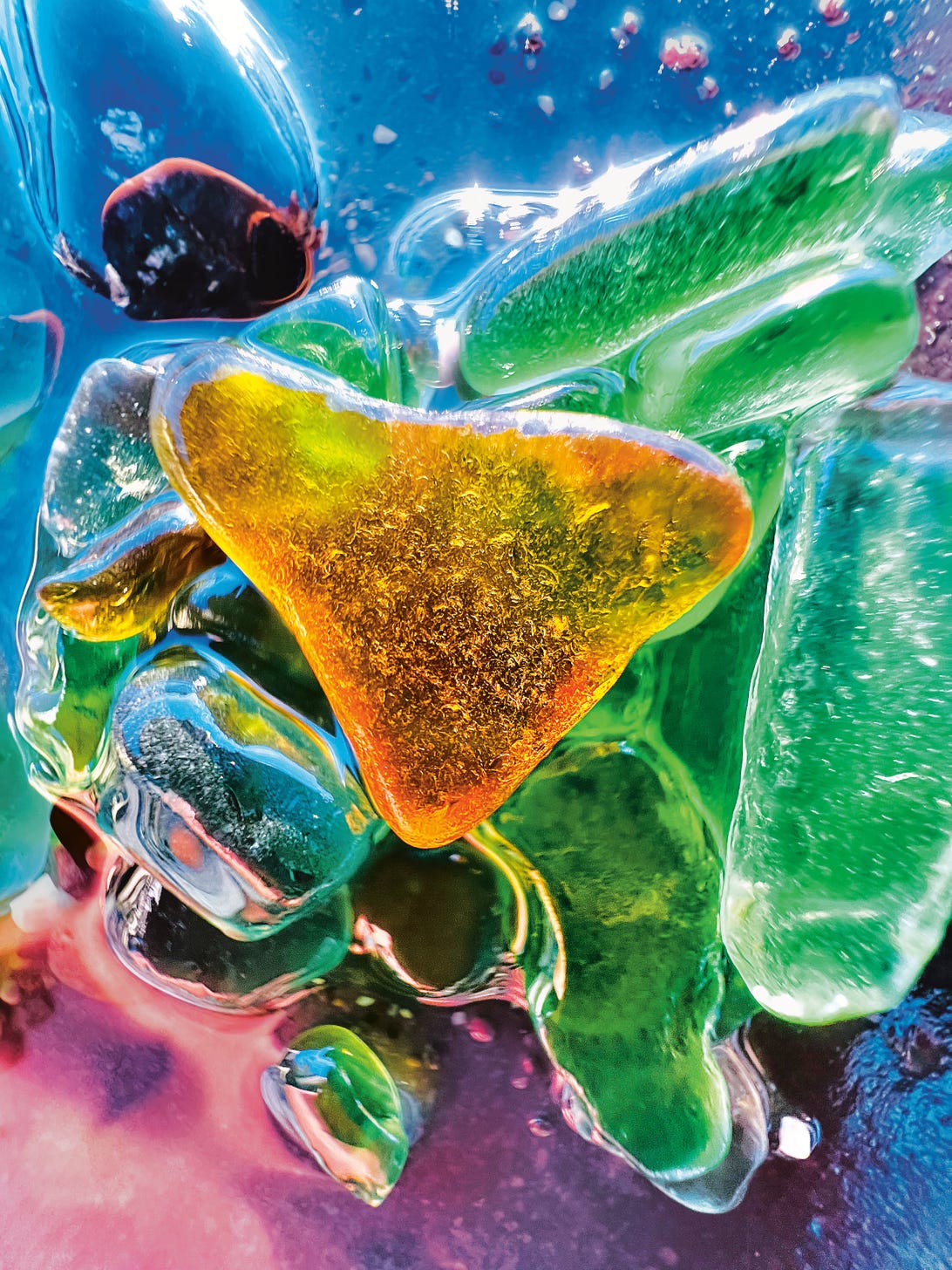 A macro photo of colorful sea glass.