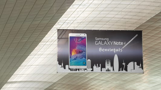 At Mobile World Congress 2015, Samsung bought rights to the big posters in the Barcelona airport terminals. This ad touts the Galaxy Note 4 phablet, a 2014 model that will be upstaged by the newer if smaller Galaxy S6 phone at the show.