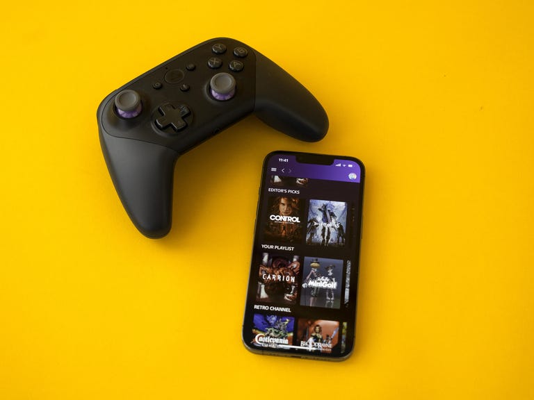 Amazon Luna home screen on the iPhone 13 Pro with the Luna controller above it