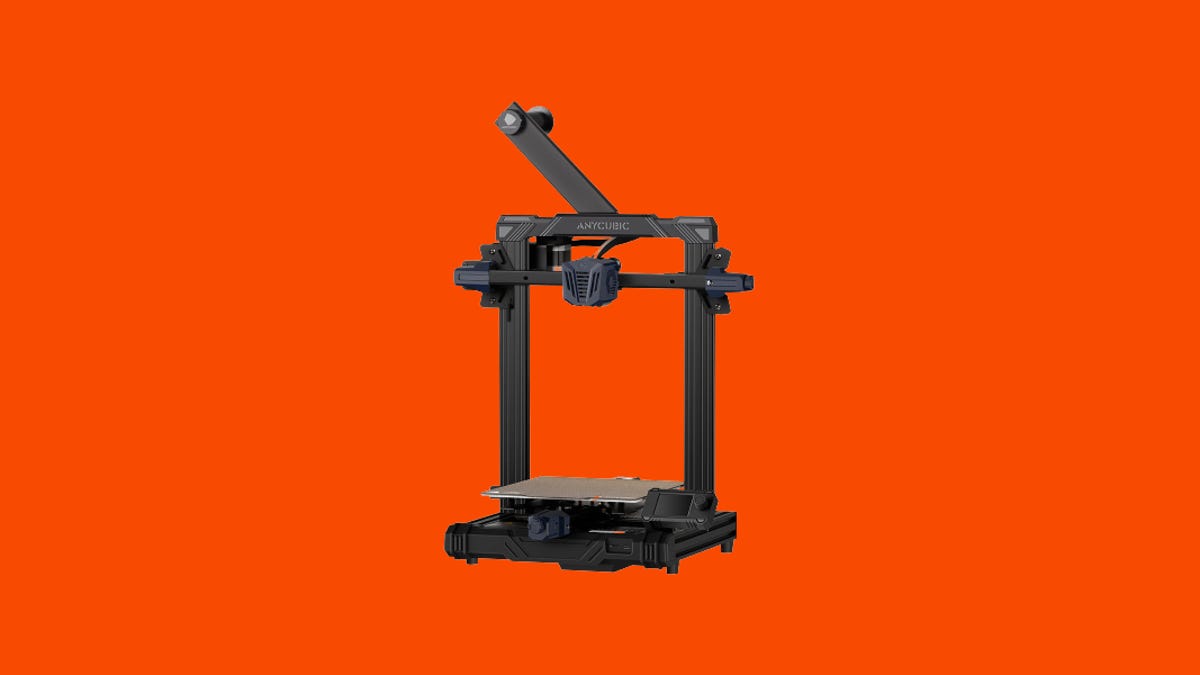 A black 3D printer on an orange background