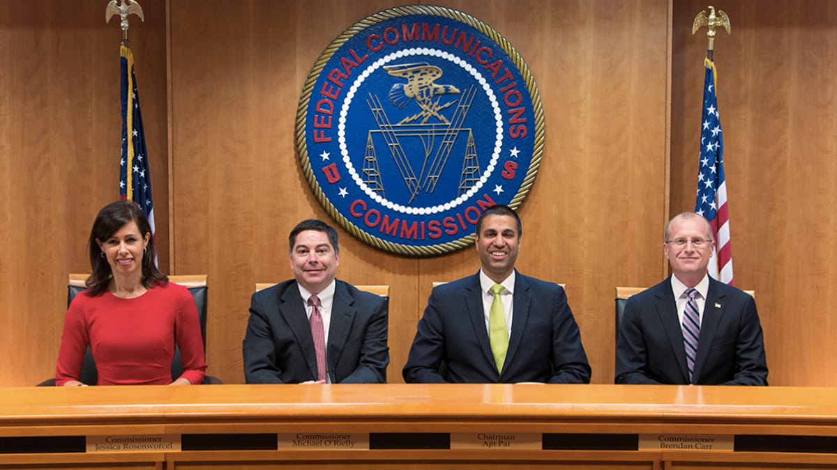 Chairman Ajit Pai (second from right) and commissioners Jessica Rosenworcel, Michael O'Rielly and Brendan Carr