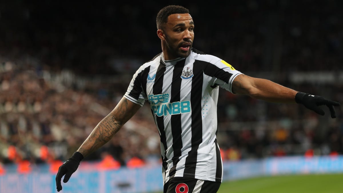 Newcastle United striker Callum Wilson looking and posting to his left.
