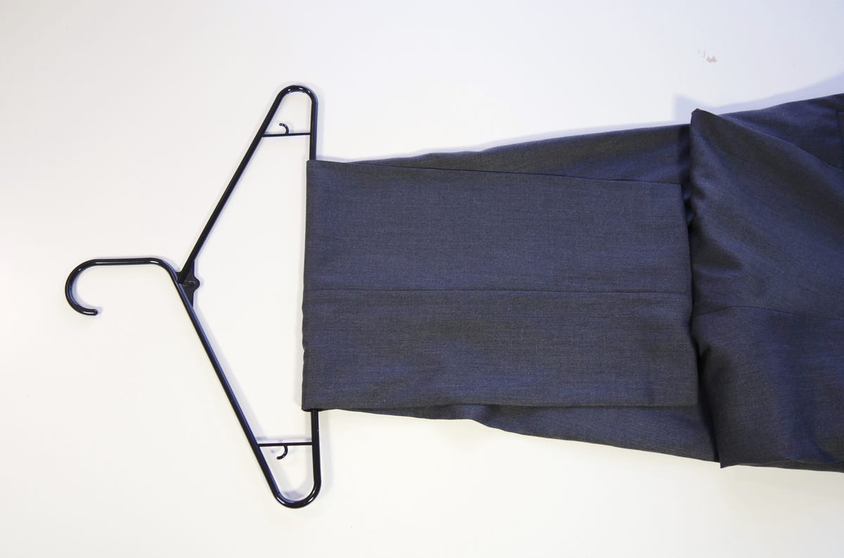 How to properly hang dress pants so they stay on the clothes hanger - CNET
