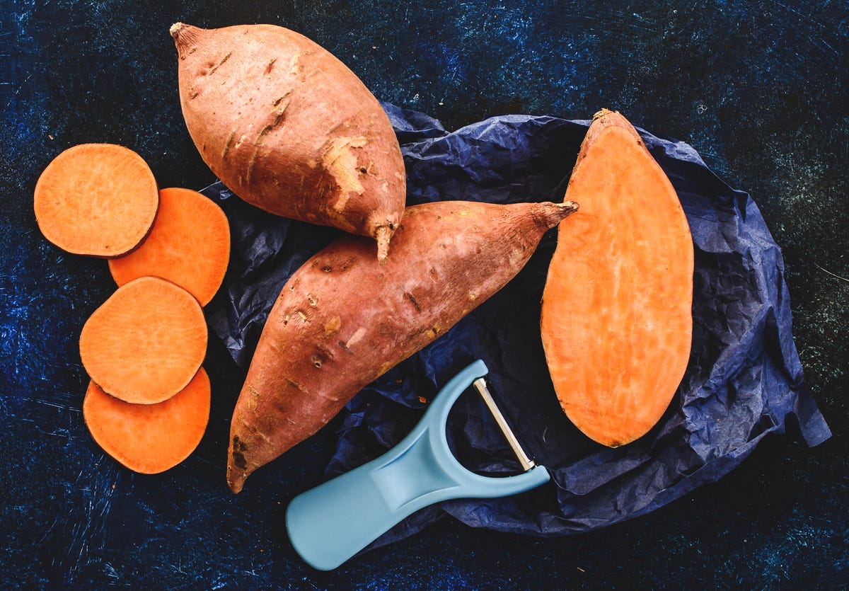 Whole and sliced sweet potatoes.