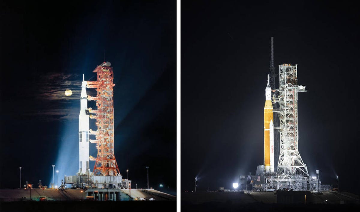 Saturn V and SLS rockets on the launchpad at night, glowing in the light.