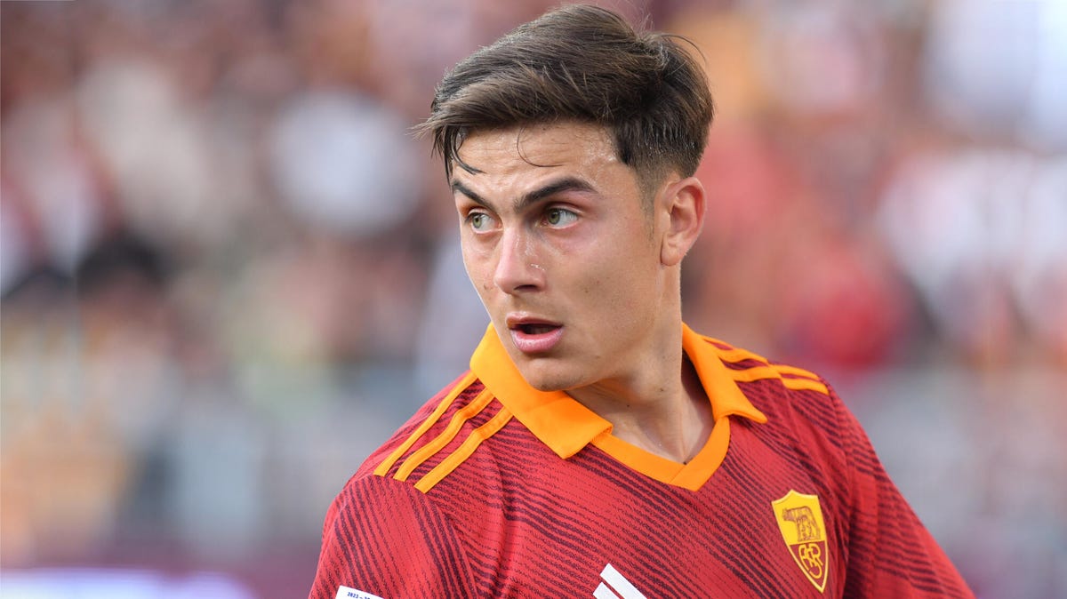 Paulo Dybala of Roma looking over his shoulder to his right.