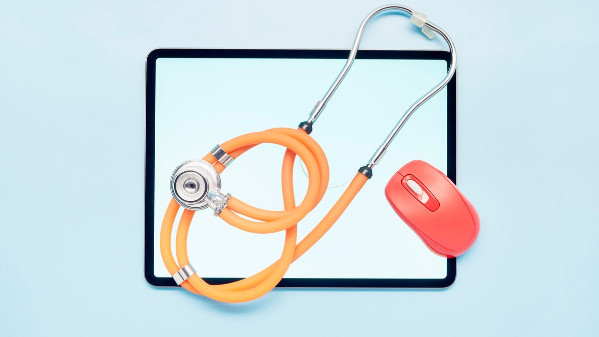An image of an iPad with a stethoscope and a mouse