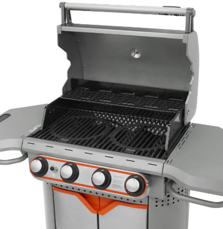 When not in use, grill inserts store underneath.