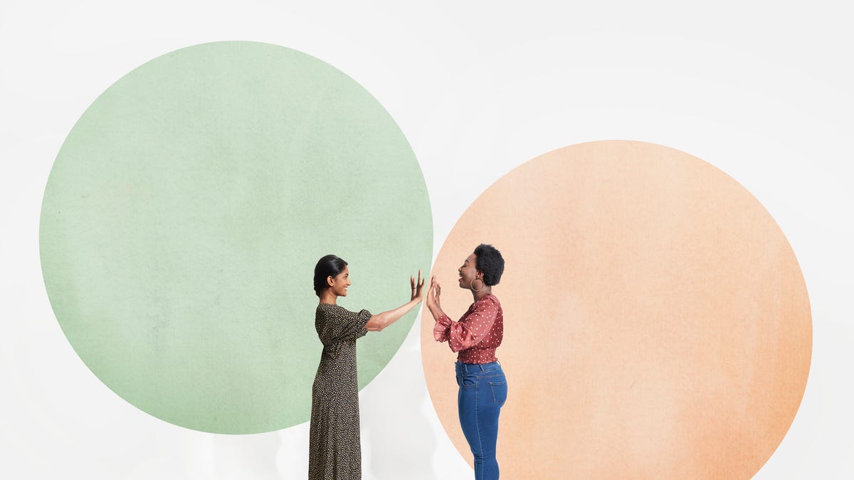 Two women standing in circles facing each other. Concept of boundaries