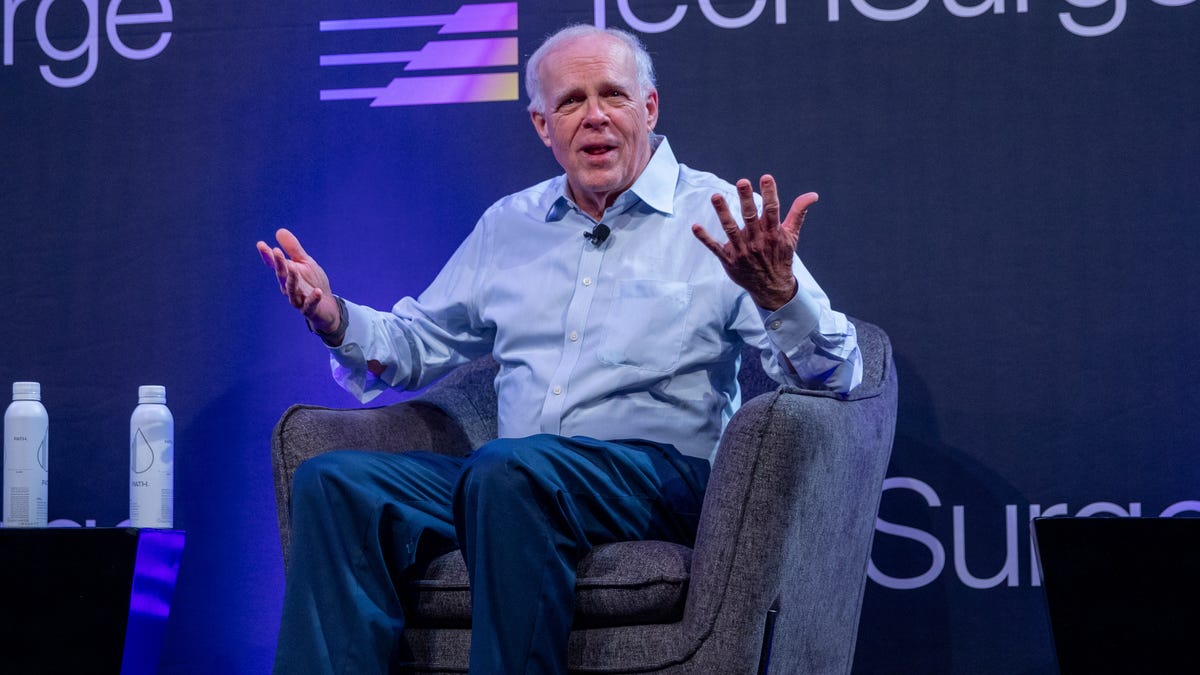 Silicon Valley pioneer John Hennessy speaks from the stage of the TechSurge conference in Silicon Valley.