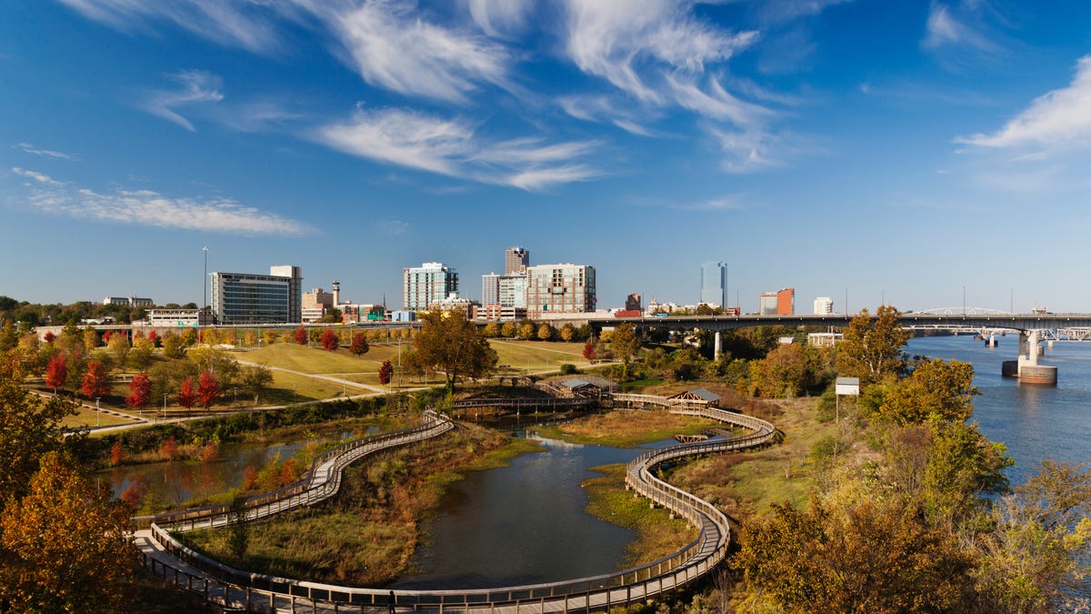 Little Rock, Arkansas, is seen from an elevated view, with a river on the right and the skyline in the center.