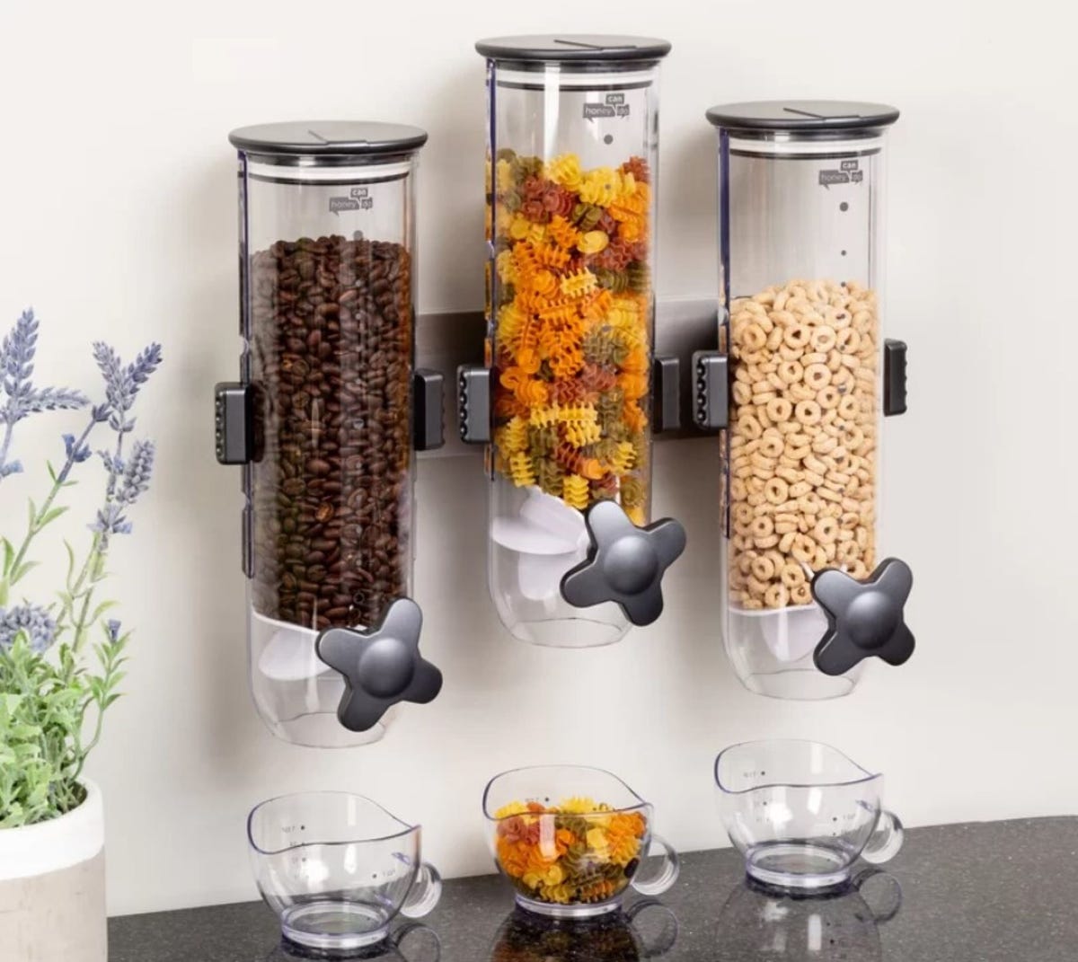 three cereal canisters attached to a wall