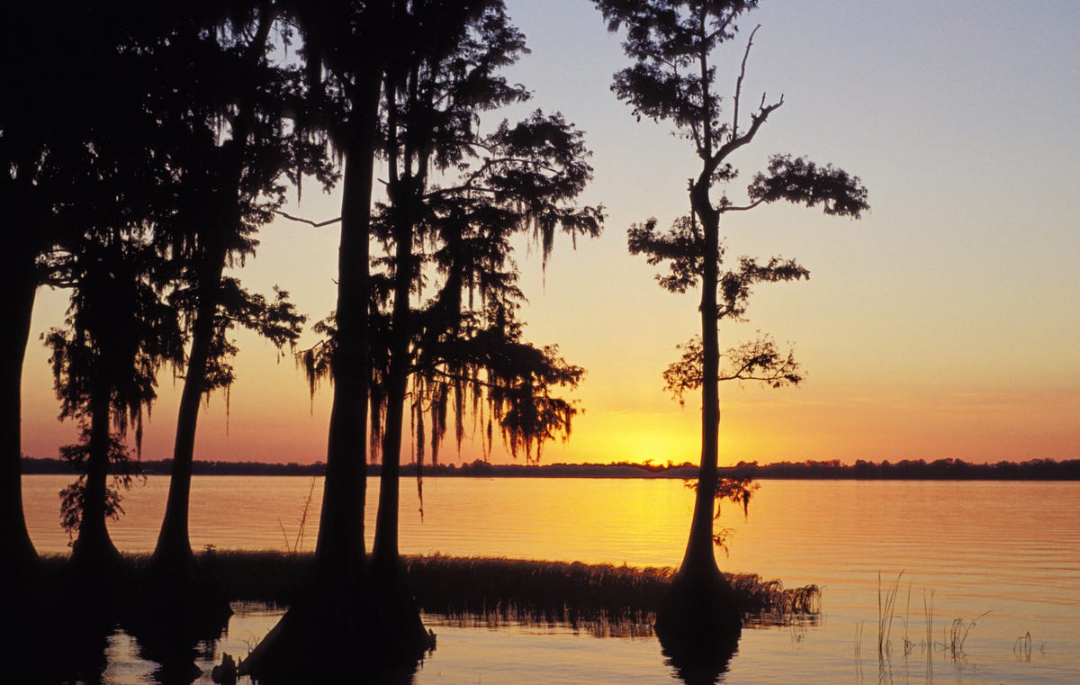 The sun sets on Lake Eloise at Cypress Gardens in Winter Haven, Florida.