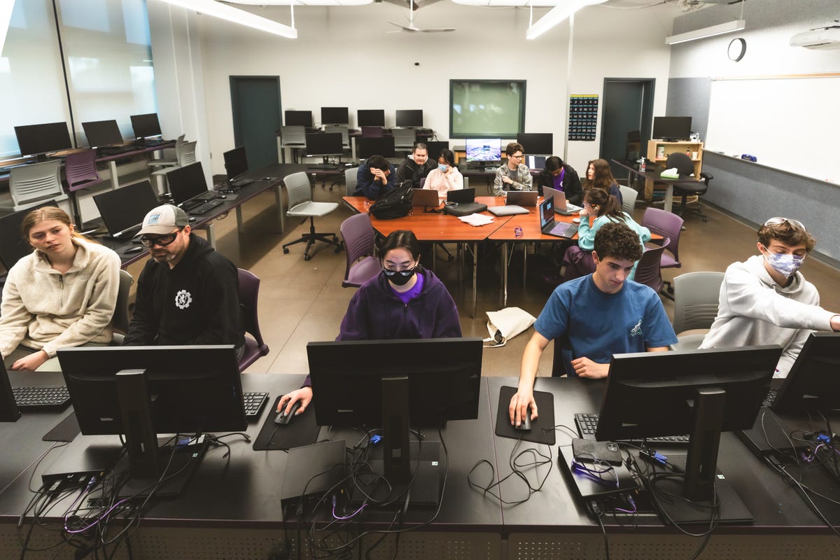 To do that, bots will need software, which Highlander Robotics members seated from left Beck Peterson, mentor Kevin Clark, Helena Young, Reece Beck Caetano de Figueiredo are seen here coding software for the competition.
