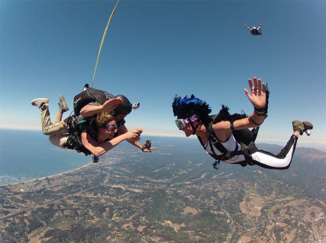 Skydiving and taking photos in mid-flight. So, that happened.