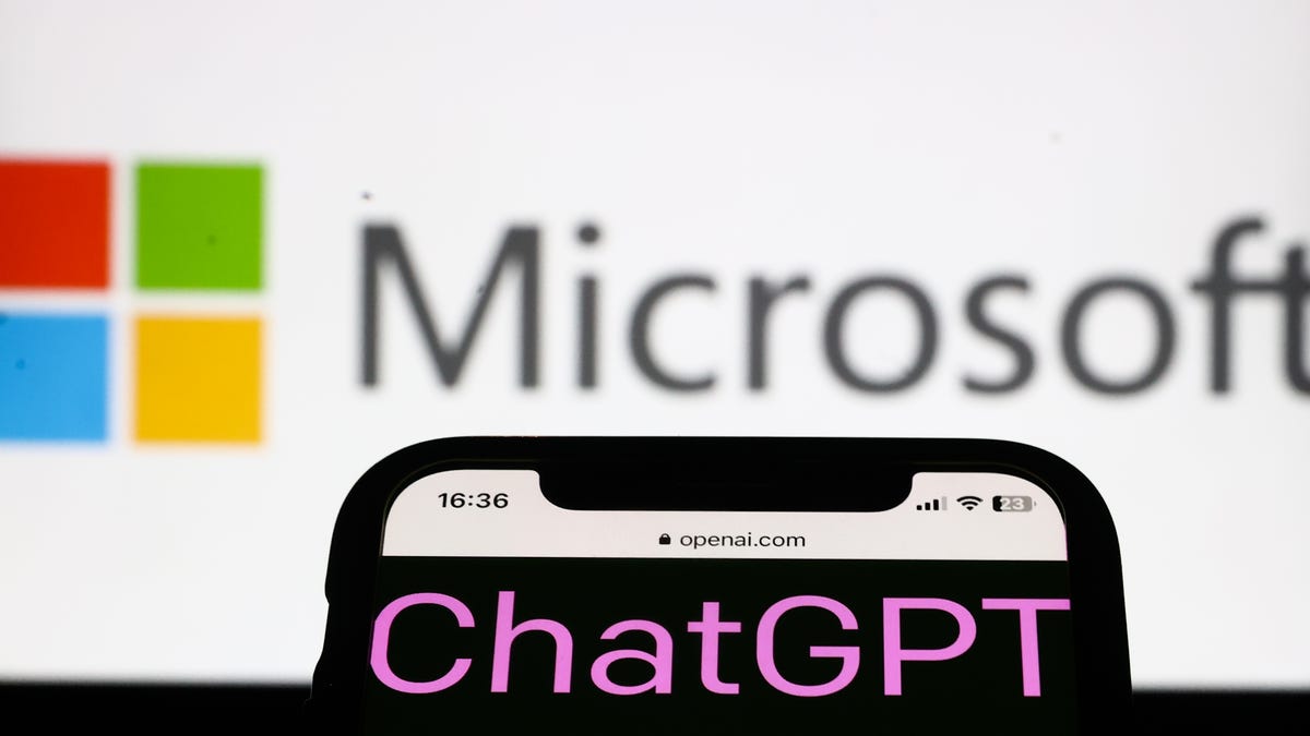 a logo of chatgpt on an iphone in front of a microsoft logo