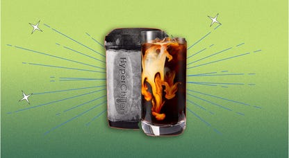 A black HyperChiller beverage cooler and a cup of iced coffee against an orange background.