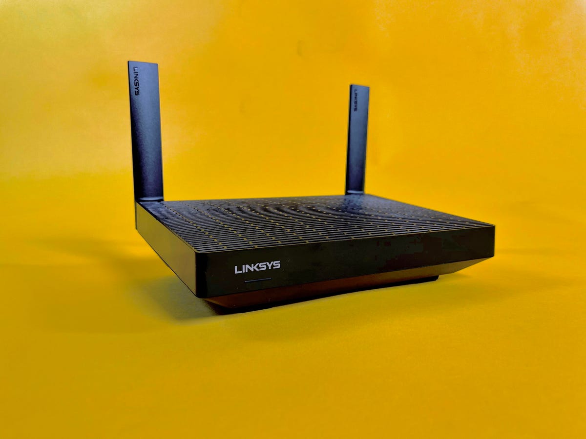 Linksys Hydra Pro 6 router on a yellow background