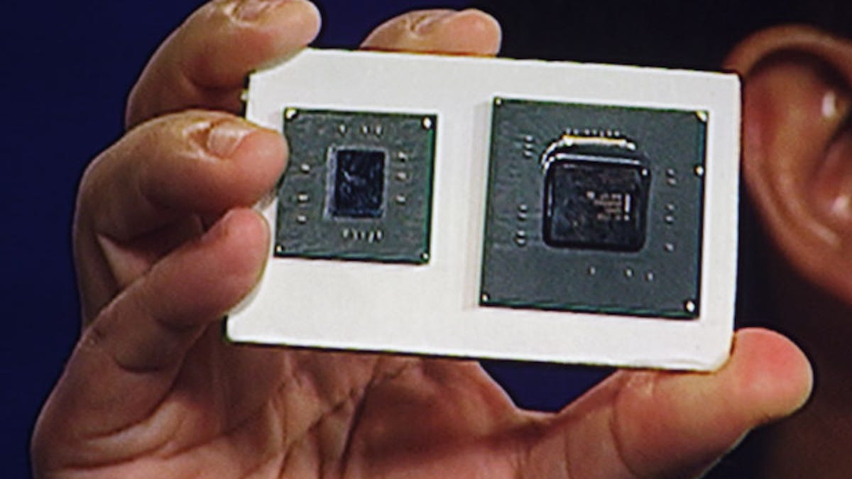 Eric Kim of Intel shows how Intel has shrunk the size of the chip (L) from the previous generation of silicon