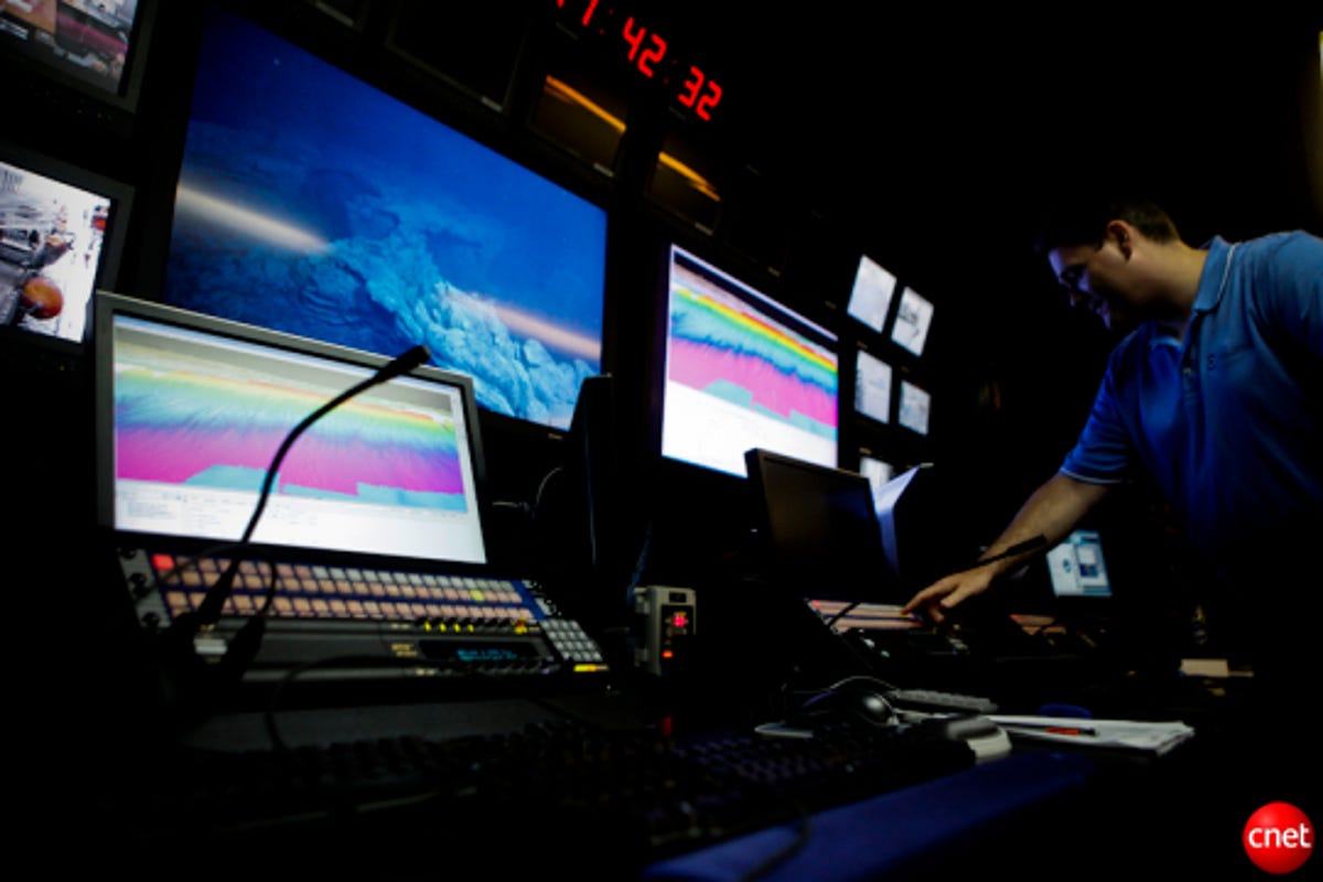 The control room is full of high-definition computer screens with topographical maps and videos of the ocean floor.