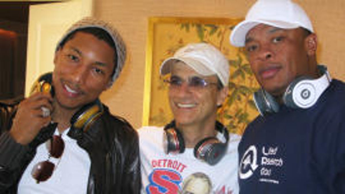 Jimmy Iovine with singer Pharrell (left) and Dr. Dre (right).