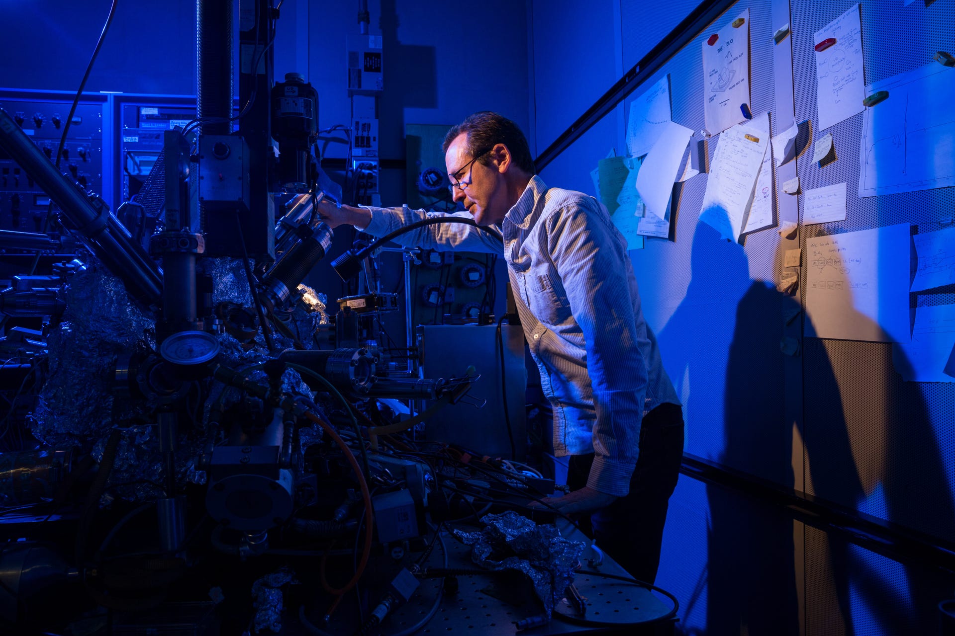 IBM researcher Chris Lutz stands by a microscope he and colleagues used to store a bit of data on a single atom at IBM Research's Almaden campus.