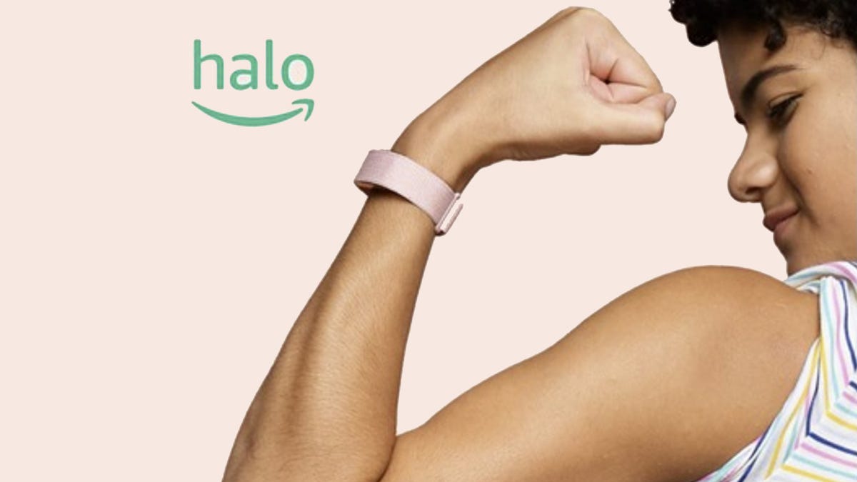 Amazon Halo band on person flexing arm muscle