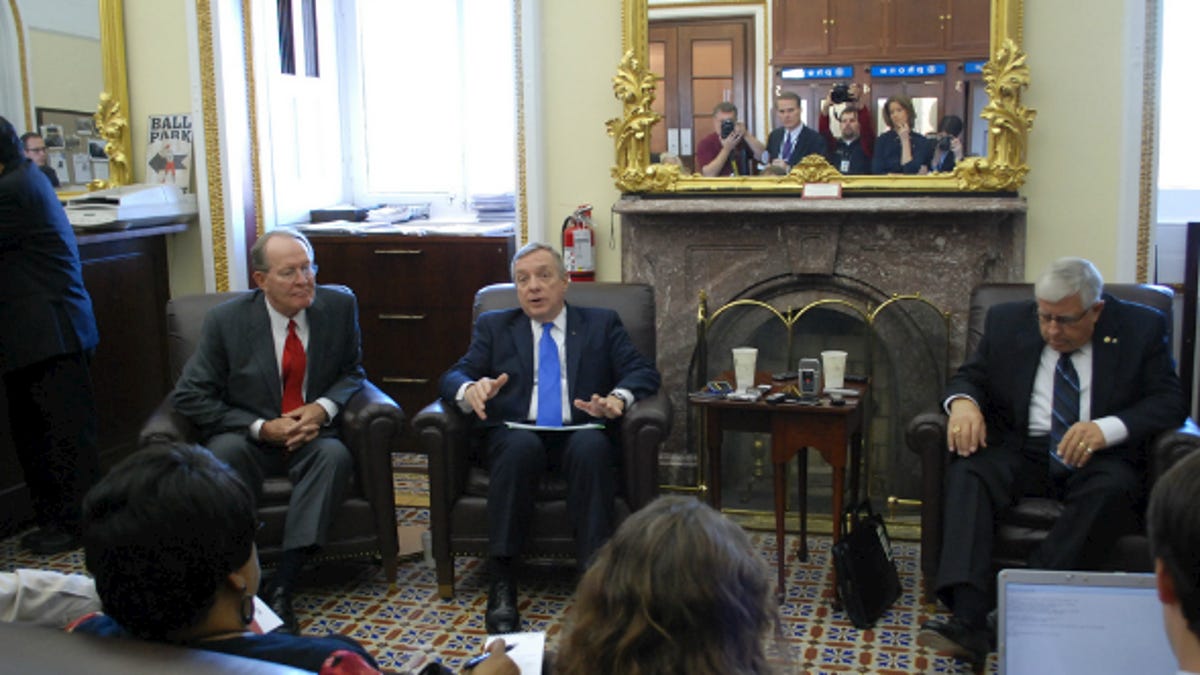 U.S. Senators Dick Durbin (D-Ill.) (left), Mike Enzi (R-Wyo.) (center), and Lamar Alexander (R-Tenn.) (right) discuss the Marketplace Fairness Act.