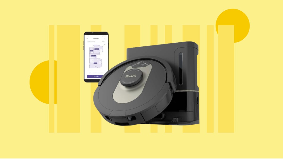 The Shark AV2501AE AI Ultra robot vacuum is displayed against a yellow background.