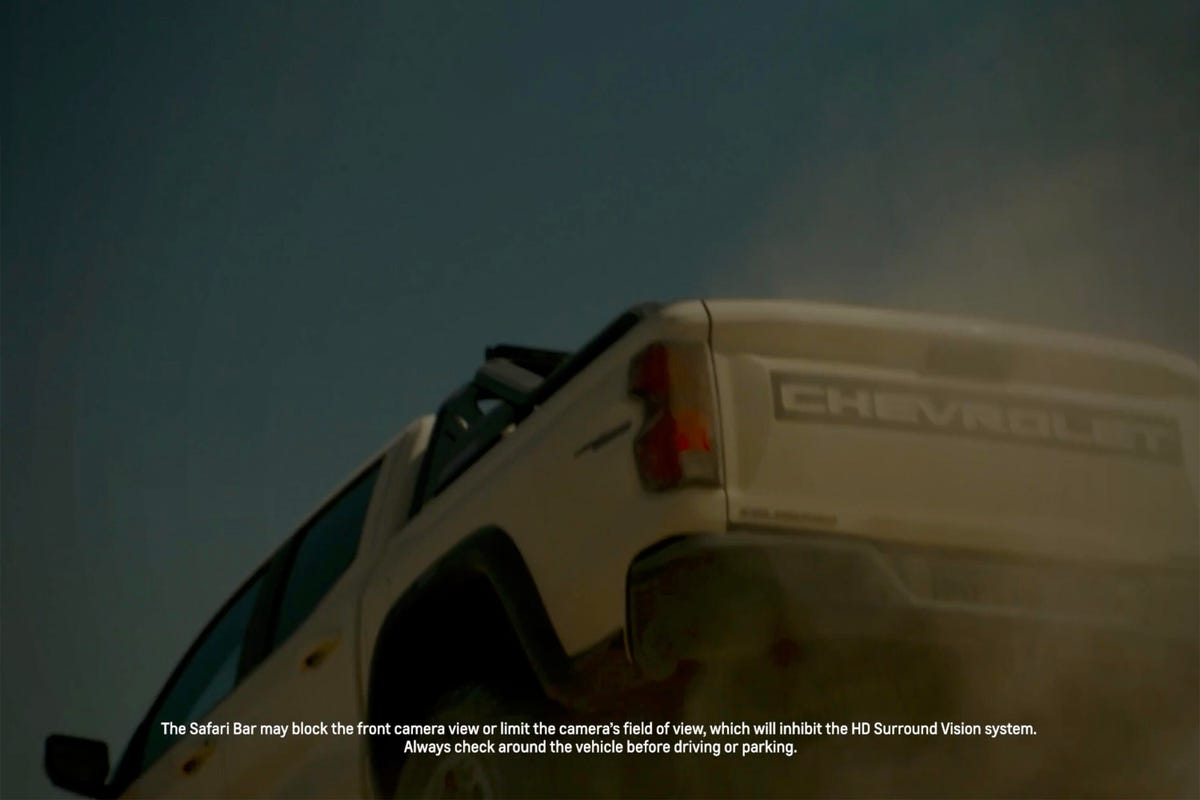 Rear 3/4 view teaser image of a beige 2023 Chevrolet Colorado ZR2