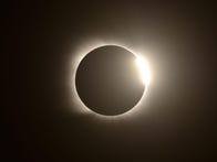 <p>The diamond ring effect is seen during the total solar eclipse from Villa Chocon, Neuquen province, Argentina on December 14, 2020. (Photo by RONALDO SCHEMIDT / AFP) (Photo by RONALDO SCHEMIDT/AFP via Getty Images)</p>