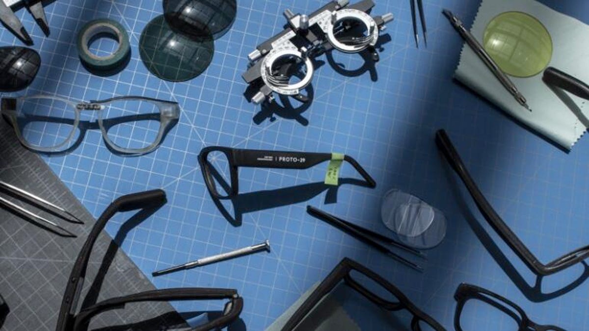 Google glasses, disassembled and laid out on a table