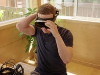 <p>Meta CEO Mark Zuckerberg tries on a prototype research headset called Holocake 2, the company's thinnest and lightest headset.</p>