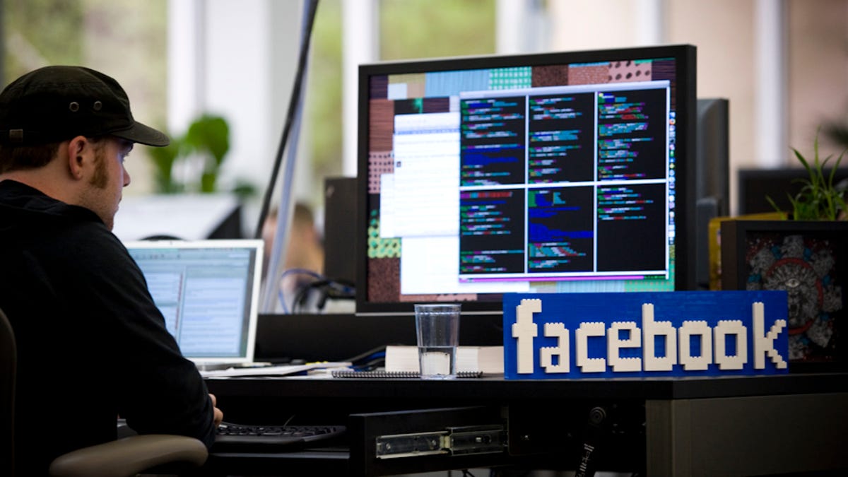 A Lego model of the Facebook logo sits on the desk of a programmer inside the company's office in Palo Alto, Calif., in June 2009.