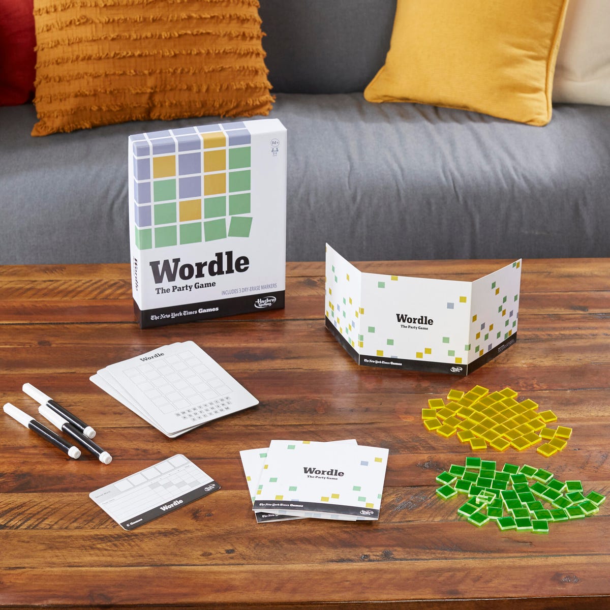 Wordle: The Party Game with yellow and green tiles, game cards and other game material