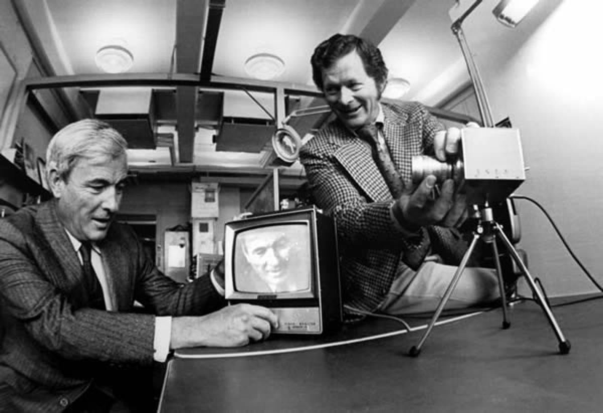 Willard S. Boyle, left, and George E. Smith of Bell Labs invented charged-coupled devices (CCDs). In this 1974 photo, they are demonstrating an experimental TV camera that contains a CCD substitute for the vacuum tube of a conventional TV camera.