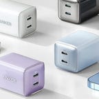 Four Anker 521 chargers are displayed near phones on a flat surface.