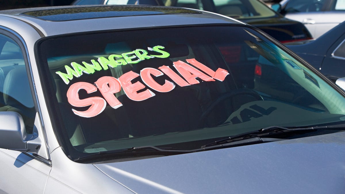 Used car with Manager's Special written on the windshield