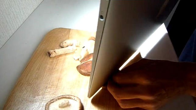 Chopping a mushroom with a MacBook Air