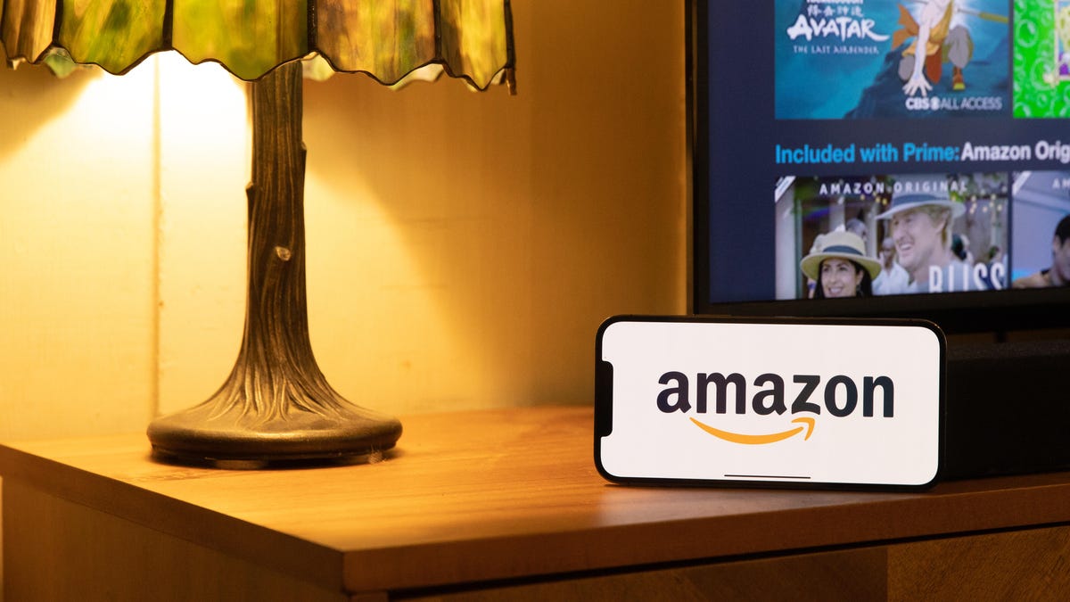 Amazon logo on a phone on a table