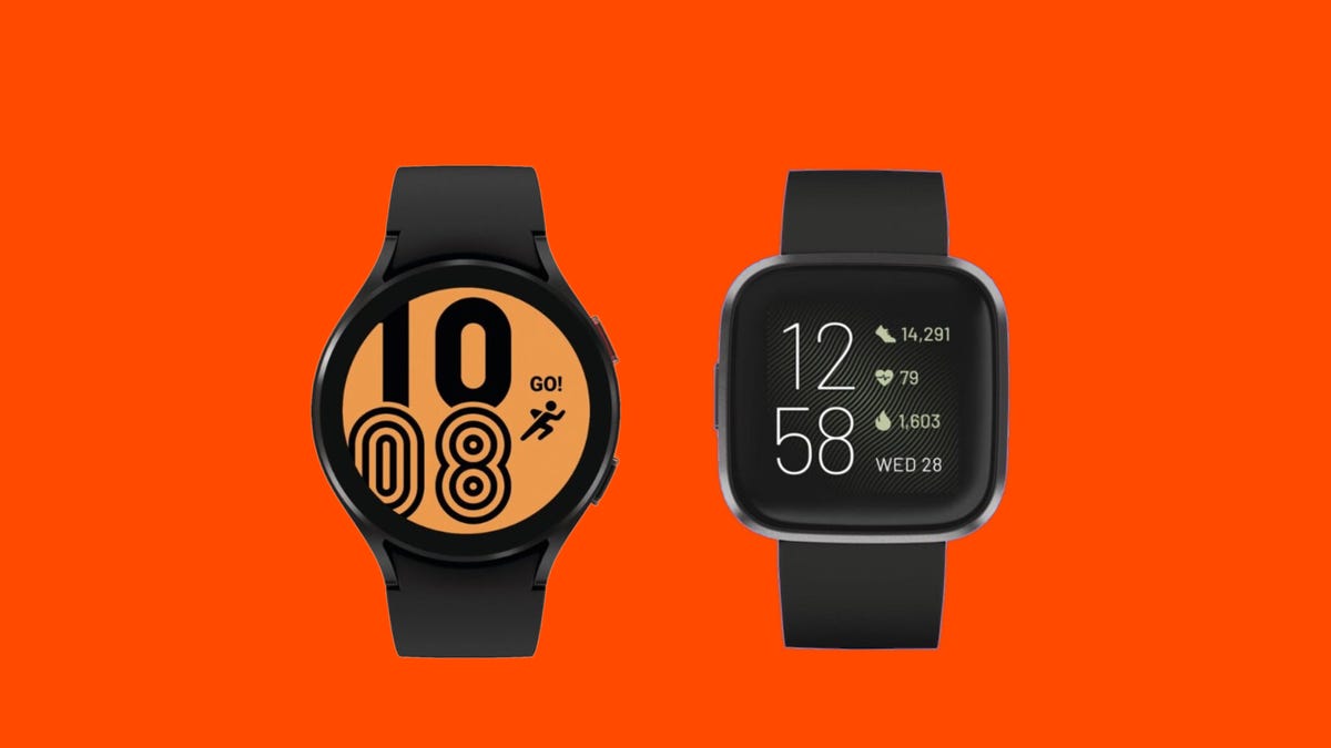A Galaxy Watch 4 and Fitbit Versa 2 next to each other on an orange background
