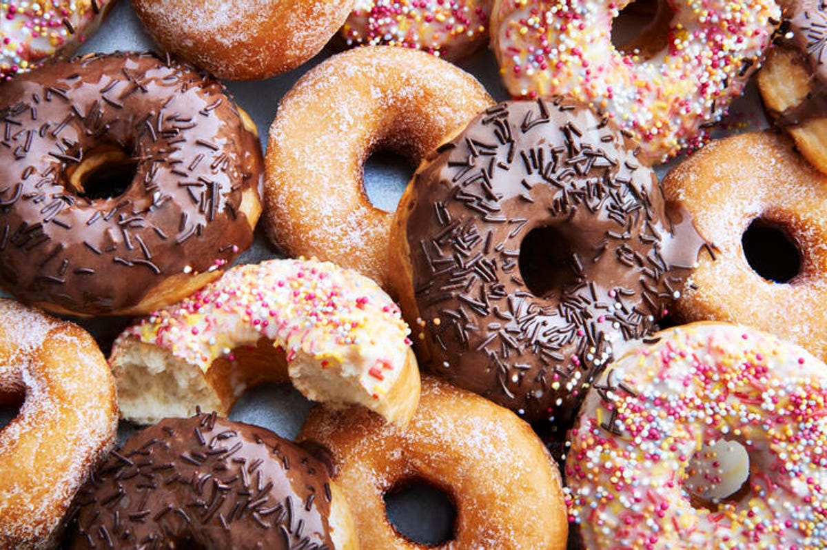 variety of donuts, some chocolate, glazed and with sprinkles 