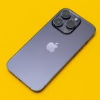back of the iPhone 14 Pro on a yellow background