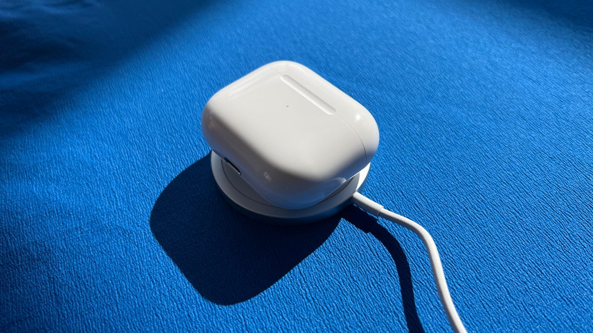 The AirPods 3 on a MagSafe charger