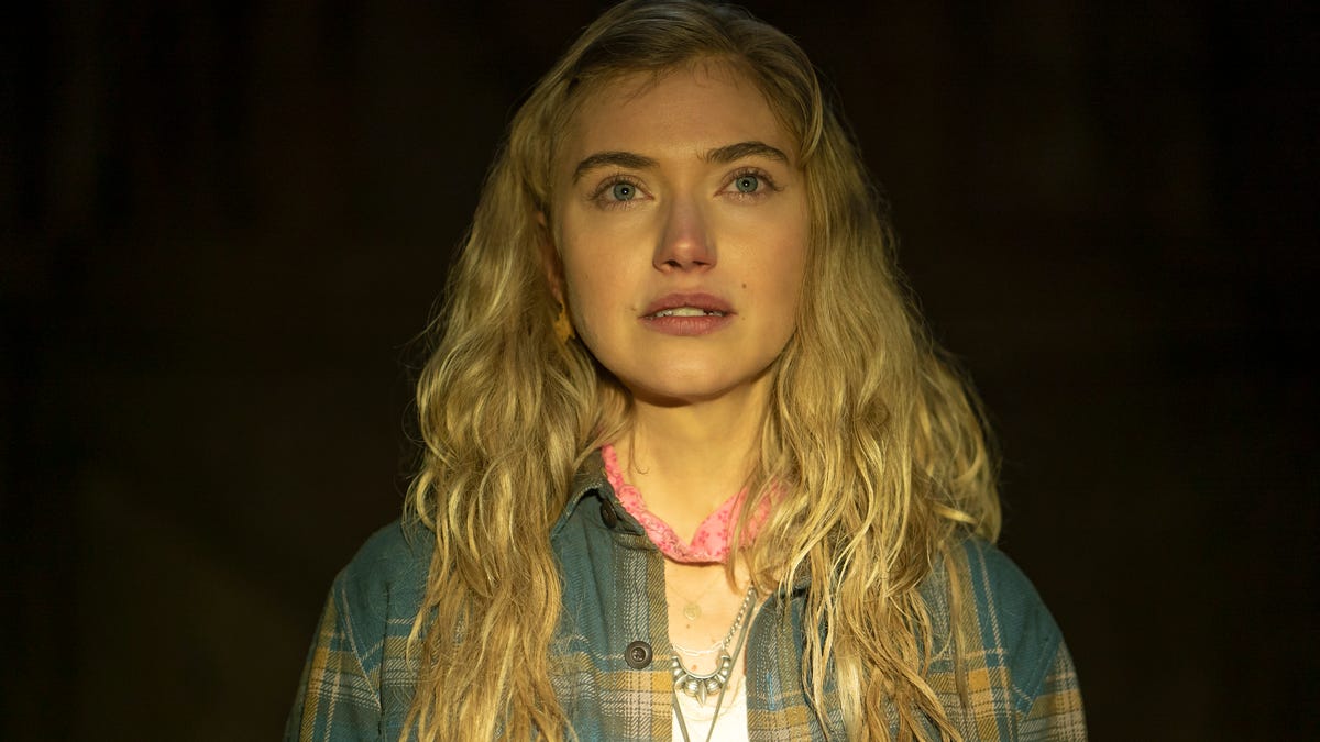 A bright light shines down on hippy-type character Autumn, played by Imogen Poots.