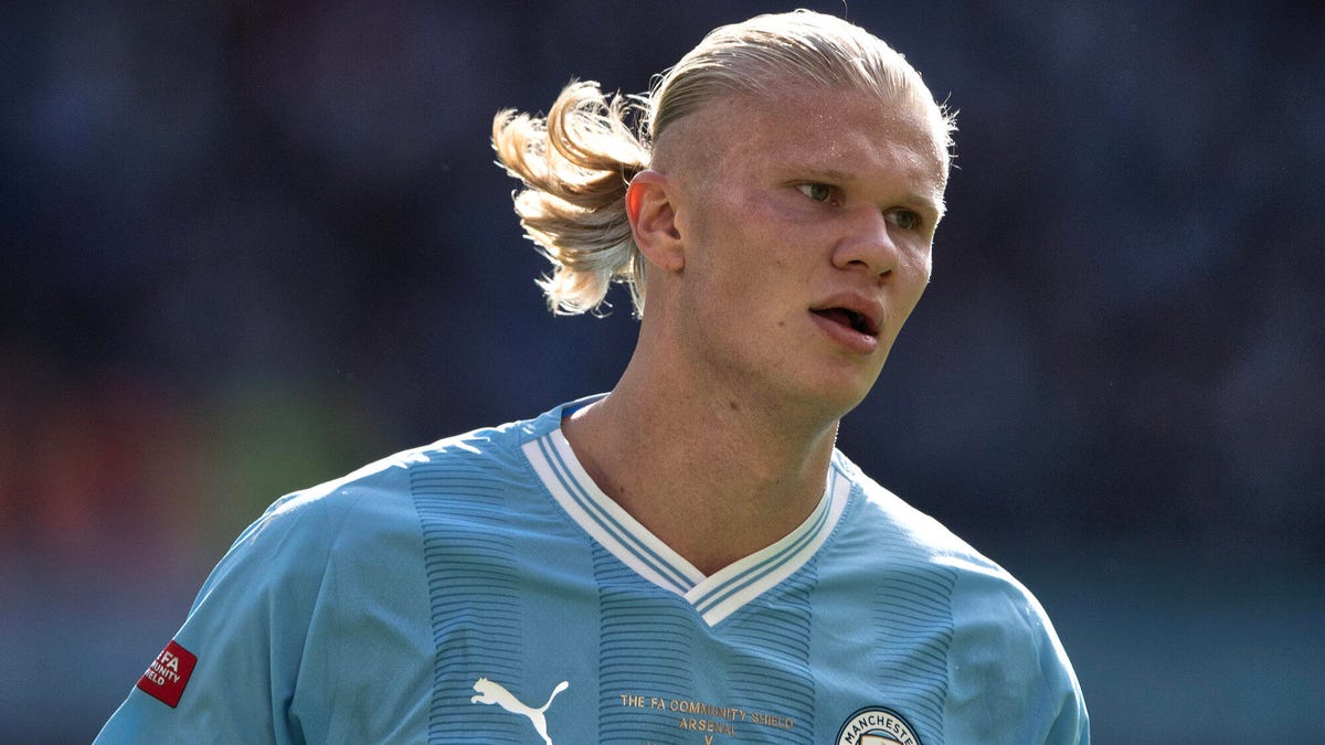 Manchester City striker Erling Haaland looks to his right.