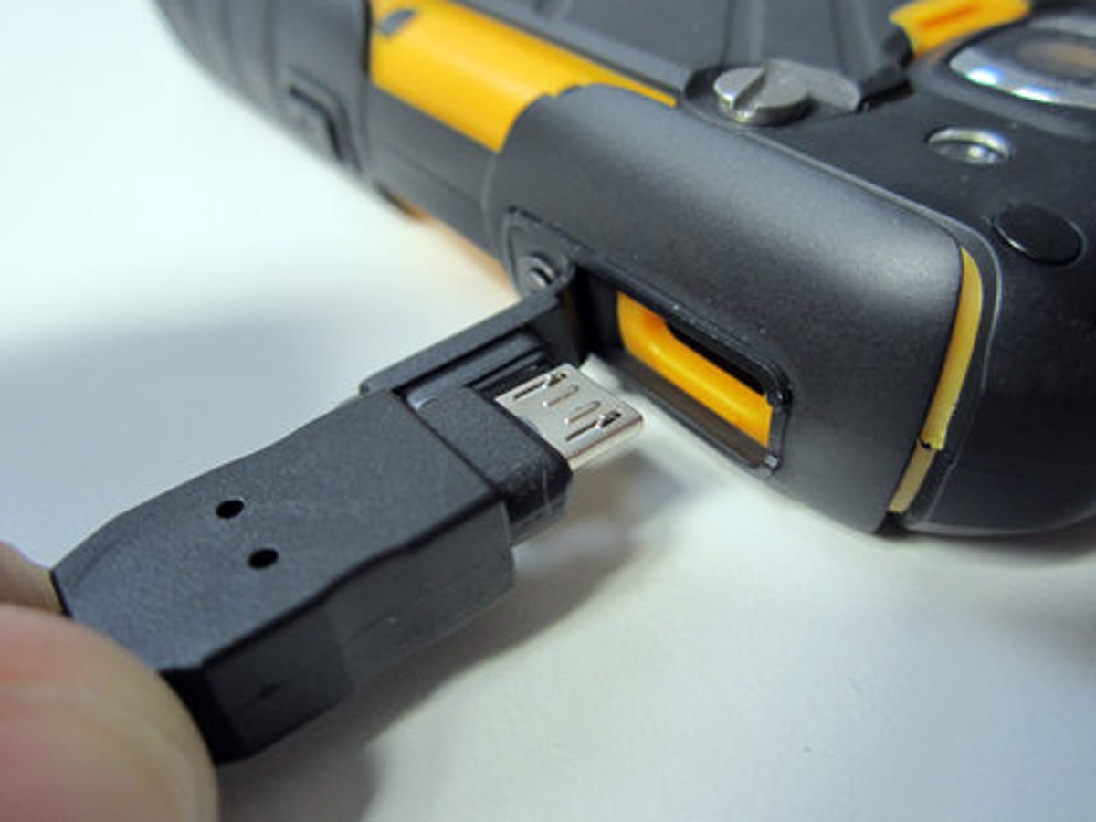 Due to the phone's thick casing, a special USB cable is required for charging and data transfer.